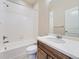 Bright bathroom featuring a shower and bath combo, toilet, and vanity with a sink at 12953 Bridge View Ln, Parker, CO 80134