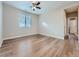 Bedroom featuring hardwood floors and natural light at 12953 Bridge View Ln, Parker, CO 80134