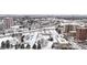 Aerial view of tennis courts and surrounding area in snowy urban setting at 63 S Jackson St, Denver, CO 80209