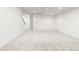 Finished basement with neutral carpeting and access to other rooms at 63 S Jackson St, Denver, CO 80209