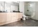 Bathroom with a walk-in shower and modern vanity at 63 S Jackson St, Denver, CO 80209