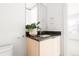 Small bathroom with a modern vanity and toilet at 63 S Jackson St, Denver, CO 80209