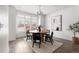 Bright dining room with round wooden table and four chairs at 63 S Jackson St, Denver, CO 80209