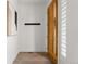 Light and bright entryway with wood door and hardwood floors at 63 S Jackson St, Denver, CO 80209