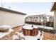 Private rooftop deck with hot tub and snowy winter view at 63 S Jackson St, Denver, CO 80209