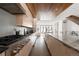 Open concept kitchen with stainless steel appliances and wood accents at 63 S Jackson St, Denver, CO 80209