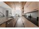 Modern kitchen with stainless steel appliances and light wood cabinets at 63 S Jackson St, Denver, CO 80209