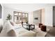 Bright living room with fireplace and sliding glass doors leading to backyard at 63 S Jackson St, Denver, CO 80209