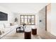 Bright living room with fireplace and sliding glass doors at 63 S Jackson St, Denver, CO 80209