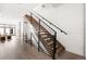 Modern staircase with metal railing and wooden steps at 63 S Jackson St, Denver, CO 80209