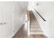 Modern staircase with wood and carpeted steps leading to upper level at 63 S Jackson St, Denver, CO 80209