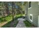 A backyard view of the house, featuring a patio, stairs and grass area at 970 Bend In The Trail Rd, Monument, CO 80132