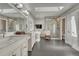 Sleek bathroom with a glass-enclosed shower, a standalone tub, and dual sinks at 970 Bend In The Trail Rd, Monument, CO 80132