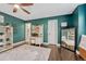 A secondary angle of this bedroom featuring a desk and ensuite bathroom at 970 Bend In The Trail Rd, Monument, CO 80132