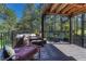 A beautiful outdoor deck with wood flooring, an outdoor couch and a lovely view at 970 Bend In The Trail Rd, Monument, CO 80132