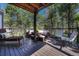 An eye-level shot of a wood deck and an outdoor living area with outdoor furniture at 970 Bend In The Trail Rd, Monument, CO 80132