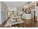 Bright dining area featuring hardwood floors, high ceilings, and elegant furnishings with view to kitchen at 970 Bend In The Trail Rd, Monument, CO 80132