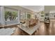 Spacious dining area adjacent to the kitchen featuring hardwood floors and large windows at 970 Bend In The Trail Rd, Monument, CO 80132