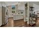 Bright and open kitchen featuring stainless steel appliances and stylish shelving at 970 Bend In The Trail Rd, Monument, CO 80132