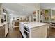 Open concept kitchen with a center island overlooking the living room at 970 Bend In The Trail Rd, Monument, CO 80132