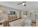 Comfortable living room with modern furnishings, hardwood floors, and an open layout leading to the kitchen at 970 Bend In The Trail Rd, Monument, CO 80132