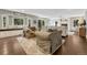 Cozy living room with a fireplace, large windows, and comfortable seating at 970 Bend In The Trail Rd, Monument, CO 80132