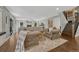 Inviting living room with hardwood floors, fireplace, neutral décor, and staircase leading to the upper level at 970 Bend In The Trail Rd, Monument, CO 80132