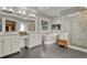 Bright main bathroom featuring a soaking tub with a TV, and a glass-enclosed shower at 970 Bend In The Trail Rd, Monument, CO 80132
