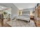 Tranquil main bedroom with hardwood floors, neutral décor, a seating area, and plenty of natural light at 970 Bend In The Trail Rd, Monument, CO 80132