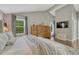 Spacious main bedroom with high ceilings, hardwood floors, a large window, and comfortable furnishings at 970 Bend In The Trail Rd, Monument, CO 80132