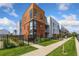 Modern brick building with multiple units and landscaped grounds at 2525 Arapahoe St # Rd108, Denver, CO 80205