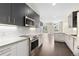 Contemporary kitchen featuring stainless steel appliances and white cabinets at 2525 Arapahoe St # Rd108, Denver, CO 80205