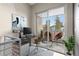 Virtually staged home office with balcony access and city views at 2525 Arapahoe St # Rd108, Denver, CO 80205