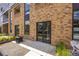 Private patio with brick wall and sliding glass door access at 2525 Arapahoe St # Rd108, Denver, CO 80205