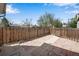 View of the fenced backyard with stone paving and a pathway, offering a private outdoor space at 7845 Barbara Ann Dr # J, Arvada, CO 80004