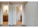 Hallway view into bathrooms and closets at 7845 Barbara Ann Dr # J, Arvada, CO 80004
