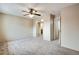 Large bedroom features carpeted floors and access to multiple bathrooms and closets at 7845 Barbara Ann Dr # J, Arvada, CO 80004