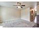 Open and inviting living room with a ceiling fan, and neutral carpet; a great gathering space at 7845 Barbara Ann Dr # J, Arvada, CO 80004