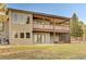 Spacious backyard patio and deck, perfect for outdoor entertaining or relaxing, with mature shade trees at 20120 Doewood Dr, Monument, CO 80132