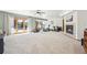 A large finished basement with neutral walls, carpeting, a fireplace, and sliding glass doors at 20120 Doewood Dr, Monument, CO 80132
