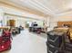 View of the unfinished basement area with workbench and access to the backyard at 20120 Doewood Dr, Monument, CO 80132