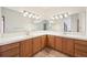 Spacious bathroom with a dual vanity, tiled floors, and large mirrors offering lots of light at 20120 Doewood Dr, Monument, CO 80132