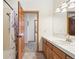 Bright bathroom featuring neutral walls, tiled floor, and shower with curtain at 20120 Doewood Dr, Monument, CO 80132