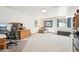 Spacious office or bedroom with desk, shelving, natural light, and neutral walls and flooring at 20120 Doewood Dr, Monument, CO 80132