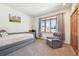 Comfortable bedroom with neutral walls and carpet, plus a bay window for natural light at 20120 Doewood Dr, Monument, CO 80132