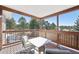 Enjoy the views from this covered outdoor deck space with a seating area and mountain views at 20120 Doewood Dr, Monument, CO 80132