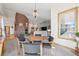 Cozy dining area with a brick fireplace, creating a warm and inviting atmosphere at 20120 Doewood Dr, Monument, CO 80132