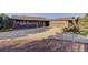 A large concrete driveway leading to a beautiful ranch-style home with an attached two-car garage at 20120 Doewood Dr, Monument, CO 80132