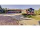 Lovely single-story home with a brick exterior, a wide driveway, and attached three-car garage at 20120 Doewood Dr, Monument, CO 80132