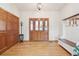 Inviting foyer with hardwood floors, a wood door and a coat rack, creating a warm and welcoming entrance at 20120 Doewood Dr, Monument, CO 80132